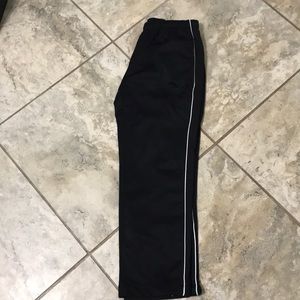 Black pants with white tattoos in the side